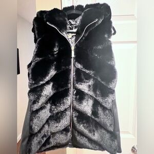 Michael Kors Faux Fur Vest. New without tags. Zipper has plastic cover wrap.